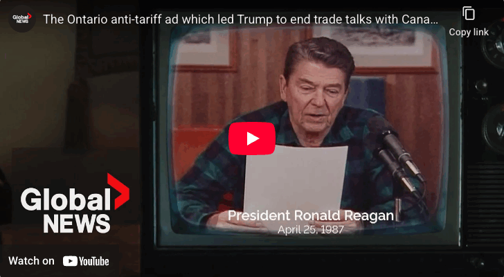 Screenshot of a YouTube video which shows Ronald Reagan wearing a plaid shirt and reading from a paper into two microphones